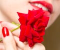 Red rose, red manicure and red lips Royalty Free Stock Photo