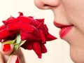 Red rose, red manicure and red lips Royalty Free Stock Photo