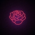 Red Rose neon sign. Light flower on brick wall background.