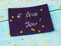 Red rose and note I love you on the craft paper. Royalty Free Stock Photo