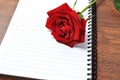 Red rose and notpad Royalty Free Stock Photo