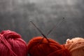 Red, rose and orange balls of yarn. Royalty Free Stock Photo