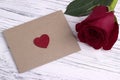 Red rose and a red heart envelope for valentine