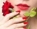 Red rose, red manicure and red lips Royalty Free Stock Photo