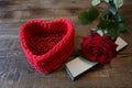 Red rose with silver box and red heart for a gift on a wooden background with copy space for text Royalty Free Stock Photo