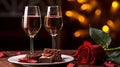 Red rose with two glasses of wine and chocalate praline on the table, romantic dinner concept, Valentine s day background. Royalty Free Stock Photo