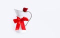 Red rose white background pitcher carafe flower milk jug gift Valentine`s day greeting card bow ribbon knot