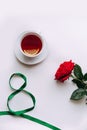 Red Rose on a white background, ribbon by March 8