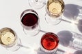 Red, rose and white wine top view in sunlight. Dark shadows Royalty Free Stock Photo