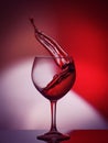 Red Rose Wine Tempting Abstract Splashing on gradient background of the white, pink and red colors on the reflective Royalty Free Stock Photo