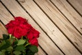 A red rose on wood slates