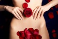 Red rosebud and petals on female's skin Royalty Free Stock Photo