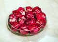 Red rosebuds in glass vase