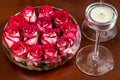 Red rosebuds in glass vase