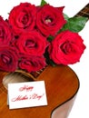 Red roses on acoustic guitar isolated for Mother's Day Royalty Free Stock Photo