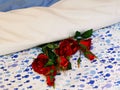 Red roses on bed linen Royalty Free Stock Photo
