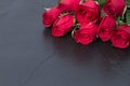 Red roses on black stone background. Valentine's day background. Royalty Free Stock Photo