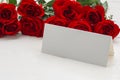 Red roses with a blank note Royalty Free Stock Photo