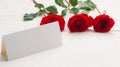 Red roses with a blank note Royalty Free Stock Photo