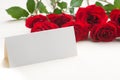 Red roses with a blank note Royalty Free Stock Photo