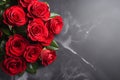 Red roses bouquet on dark stone background