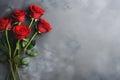 Red roses bouquet on dark stone background