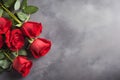 Red roses bouquet on dark stone background