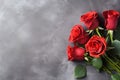 Red roses bouquet on dark stone background