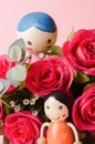 Red roses and couple doll Royalty Free Stock Photo