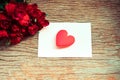 Red roses flower bouquet romantic love valentines day card envelope letter mail with red heart - Invitation card wedding on wood Royalty Free Stock Photo