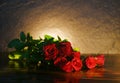 Red Roses Flower Bouquet On Rustic Wood And Candlelight Background - Flowers Rose Petals Romantic Love Valentine Day Concept