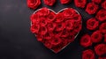 Red roses in heart shaped box on black background with copy space. Valentine\'s day. Royalty Free Stock Photo
