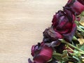 Red roses over wooden table. Valentines day background. Top view with copy space Royalty Free Stock Photo
