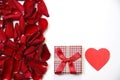 Red roses petals and heart Royalty Free Stock Photo