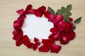 red roses petals and white blank paper Royalty Free Stock Photo