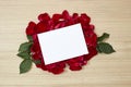 red roses petals and white blank paper Royalty Free Stock Photo