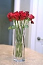 Red Roses in Tall Crystal Glass Vase