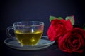 Red Roses and Tea in Glass