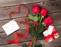 Red roses with Valentines day greeting card and gift Royalty Free Stock Photo