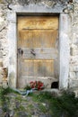 Red roses wedding bouquet and old wooden door Royalty Free Stock Photo