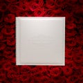 Red roses with white book Royalty Free Stock Photo