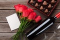 Red roses, wine bottle and chocolate box