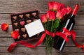 Red roses, wine bottle and chocolate box