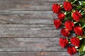 Red roses on a wooden background. Greeting card. Copy space. Flat lay. Mothers day,valentines day,womans day concept