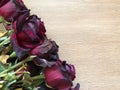 Red roses over wooden table. Valentines day background. Top view with copy space Royalty Free Stock Photo