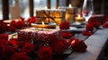 Red roses and a wrapped gift rest on table, with lit candles and a wine glass setting a romantic mood Royalty Free Stock Photo