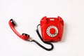 Red rotary telephone off hook on white background Royalty Free Stock Photo