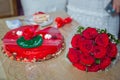 Red round cake. Red flowers on the cake. Red rose on the cake . Red roses wedding bouquet . Royalty Free Stock Photo
