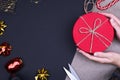 Red round gift box on black background, new year and Christmas gift wrapping,copy space Royalty Free Stock Photo