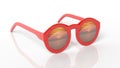 Red round-lens sunglasses with sunset reflection on lens Royalty Free Stock Photo